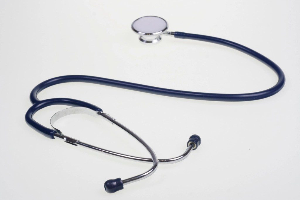 A stethoscope lying on a plain white surface