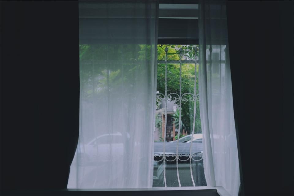 Sheer curtains drawn across a window
